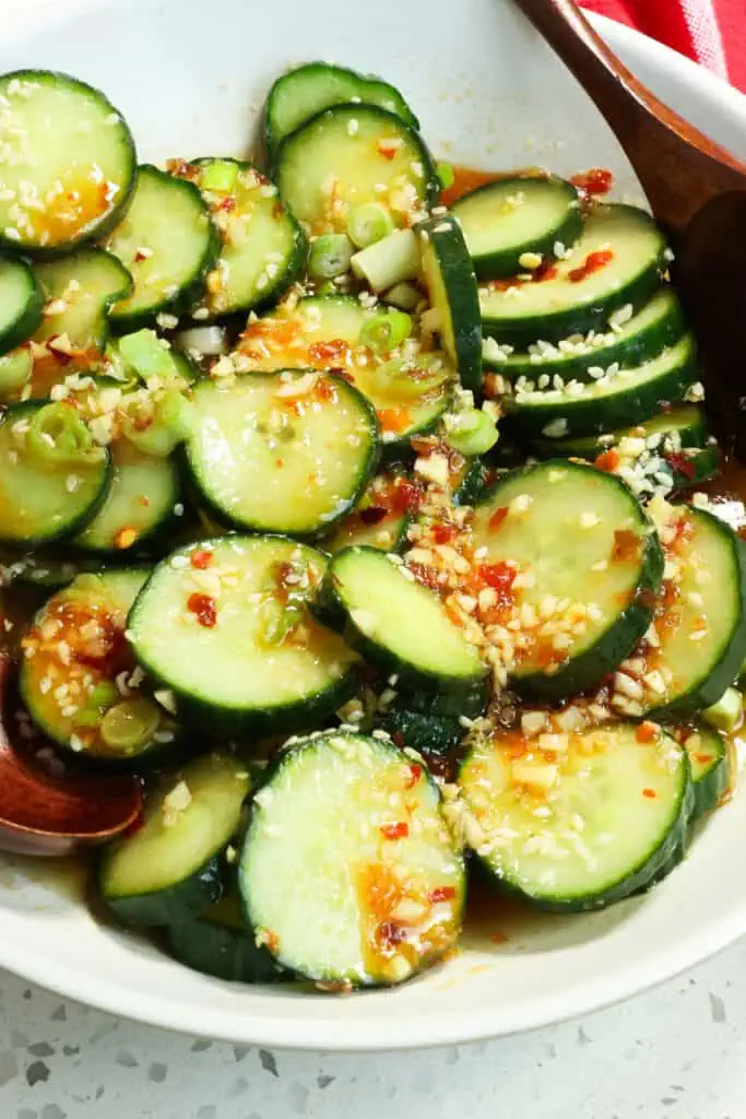 This Asian Cucumber Salad is spicy, sweet, and refreshing with rice vinegar, soy sauce, sugar, sesame oil, ginger, and chili paste. 