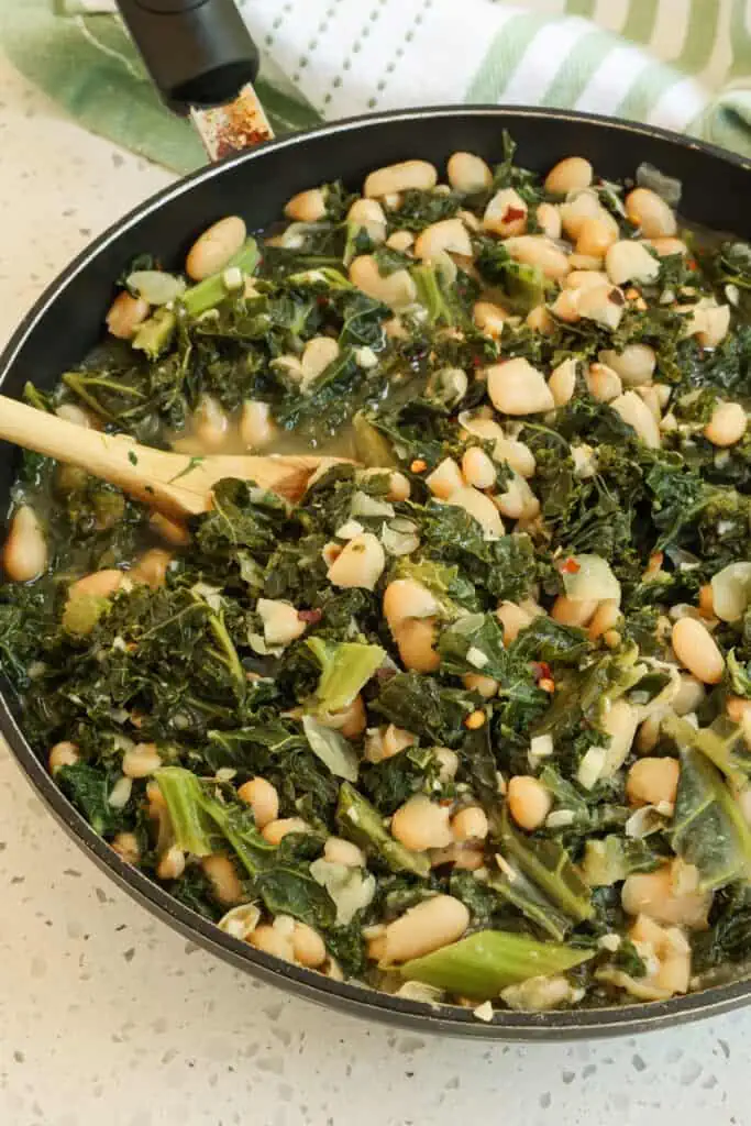 These Beans and Greens are easy, hearty, and southern-style delicious. Serve this tasty recipe as a side dish for fried chicken or fish or a meatless main entree.
