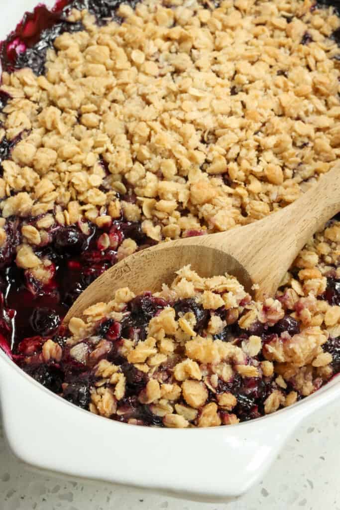 A quick and easy scrumptious Blueberry Crisp made with fresh blueberries and topped with a six-ingredient buttery crisp topping made with oats, brown sugar, and flour.