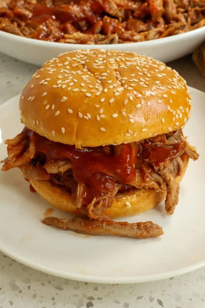 Crock Pot Pulled Pork cooks up super tender and flavorful with an easy seven-ingredient rub. Serve it in soft tacos, quesadillas, pizza, soup, sandwiches, and nachos.