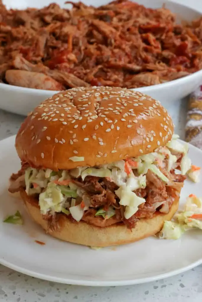 This Crock Pot Pulled Pork is melt-in-your-mouth tender pork shoulder butt seasoned with a dry rub and slow-cooked to perfection. 