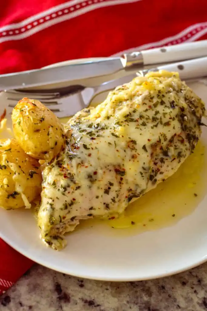 This family friendly easy recipe combines chicken breasts and baby potatoes in fresh garlic butter sauce topped with mozzarella.