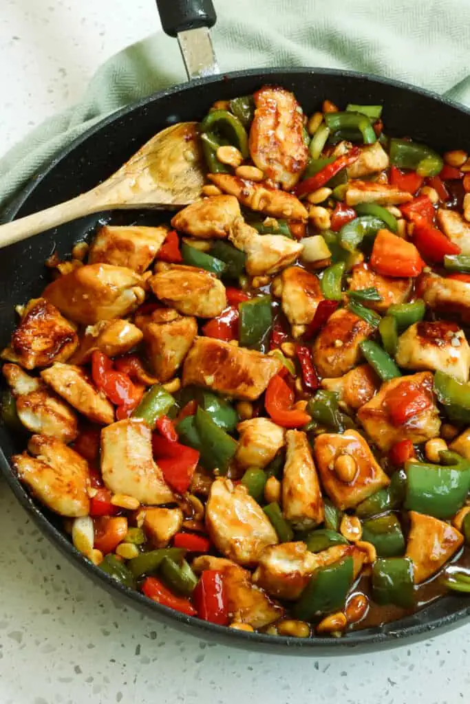 Kung Pao Chicken is the ultimate stir-fried experience.  It is loaded with delicious flavor from tender marinated chicken, bell peppers, green onion, and peanuts in a sweet and salty, slightly spicy sauce that leaves you licking your plate. 