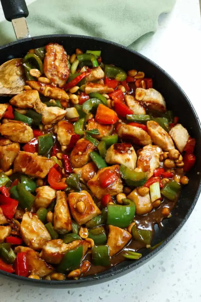 Kung Pao Chicken is the ultimate stir fry experience.  It is loaded with delicious peppers, scallions and peanuts in a sweet and salty slightly spicy sauce. Make this favorite takeout dish at home for a delicious experience!