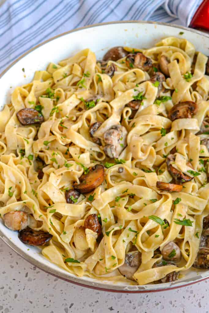 This is a quick and easy creamy mushroom pasta recipe with white button mushrooms, cremini mushrooms, garlic, and fresh thyme, all in a rich, creamy beef broth. 