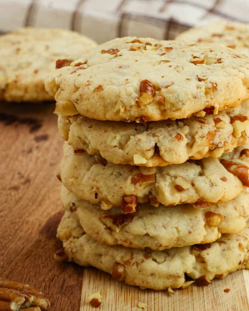 A close up view of pecan sandies on a cutting board. 