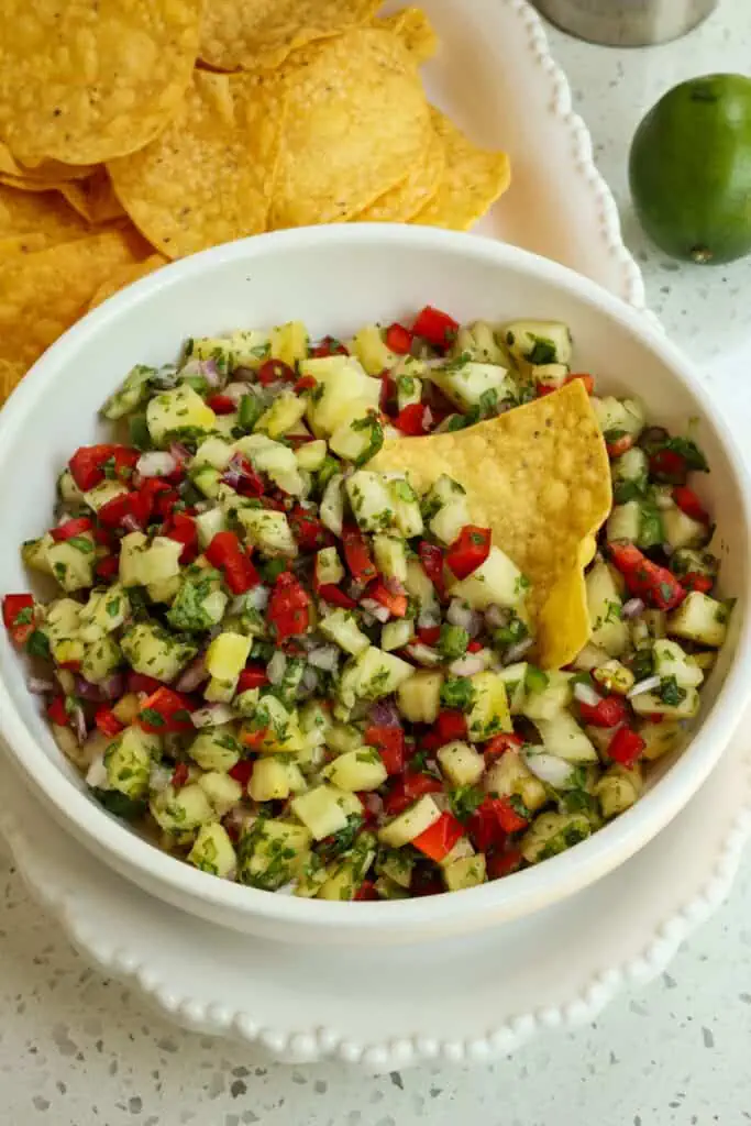 This tasty, quick, and easy Pineapple Salsa is great over grilled chicken, fish, shrimp, tacos, quesadillas, burritos, omelets, and turkey tenderloins. 