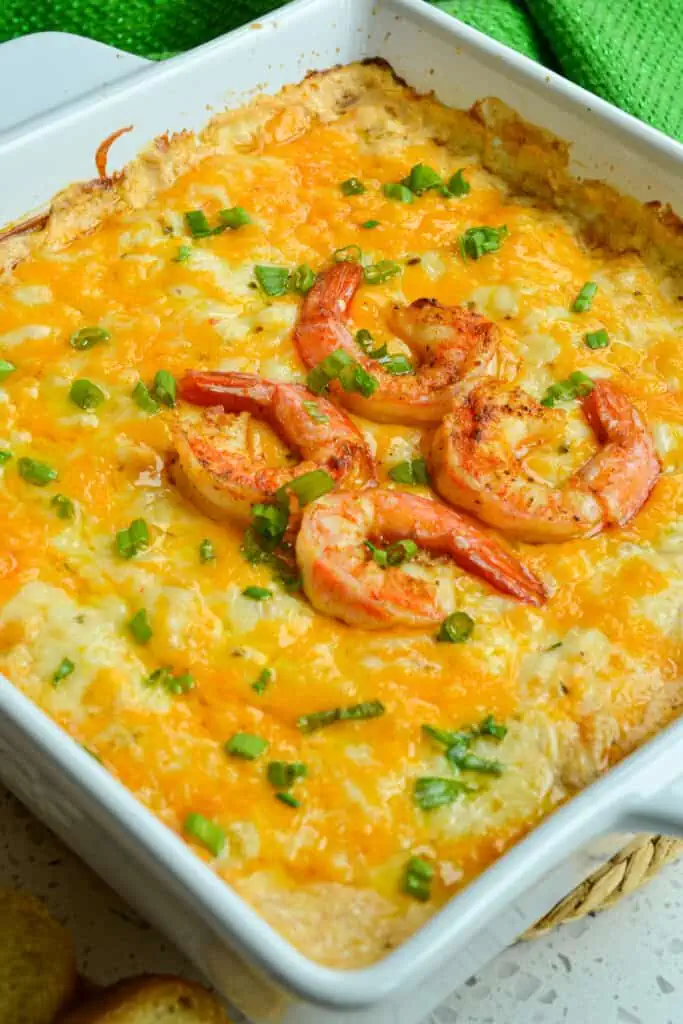 An easy to make mouthwatering cheesy shrimp dip with succulent shrimp, cheddar, pepper jack, Old Bay Seasoning and garlic. 