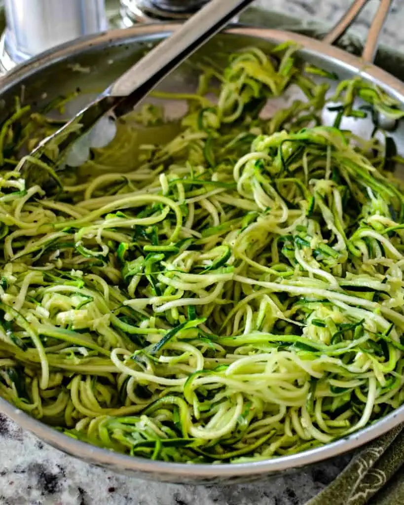 Zucchini Noodles are a fun easy vegetable that is lightly seasoned and works as a noodle replacement.  They are kid approved, easy to prep and quick to cook.