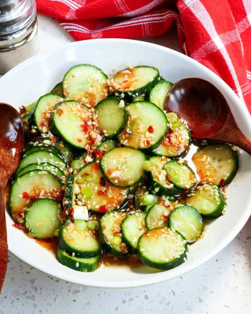 A close up view of a bowl of Asian cucumber salad