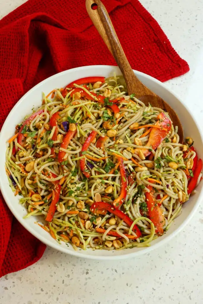 A beautiful and flavor packed Asian Noodle Salad full of crisp vegetables, peanuts, and sesame seeds all tossed in a sweet and savory peanut ginger sauce.