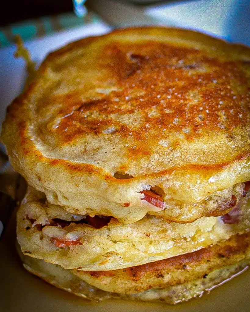 Combine the cherry whiskey with maple syrup and drizzle over the pancakes. Sprinkle with a little extra bacon. 