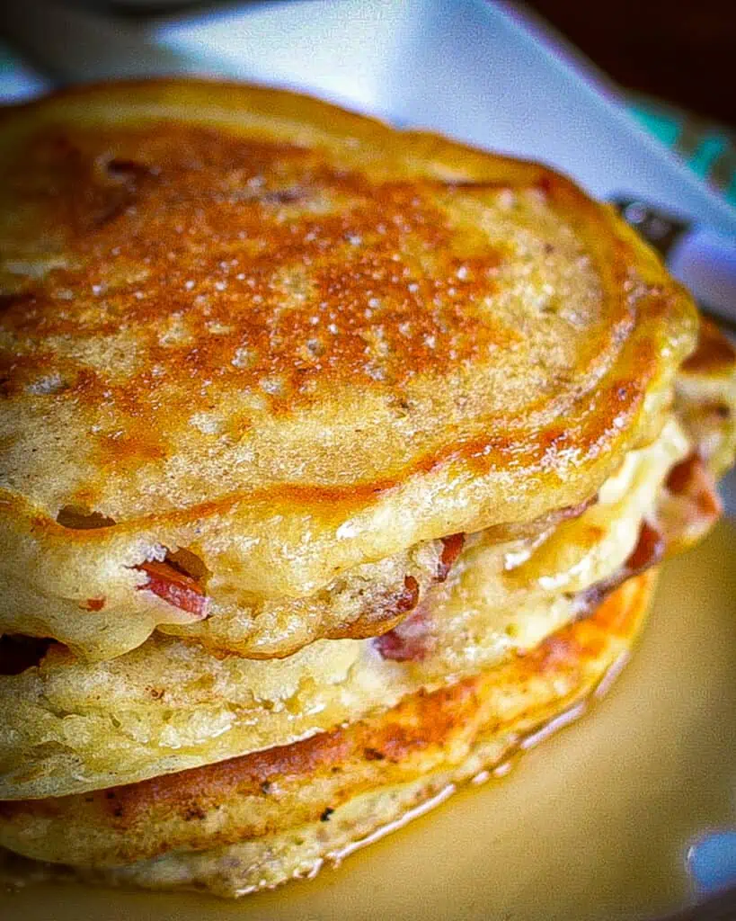 Buttermilk Bacon Pancakes are light fluffy pancakes with crisp edges and bits of hearty smoked bacon in every bite. 