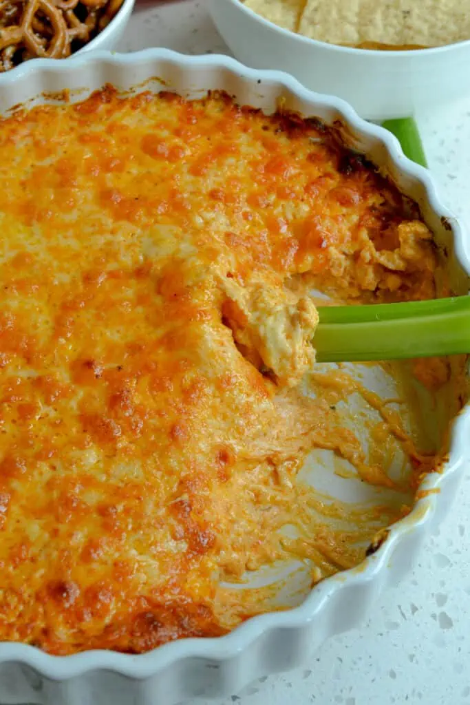 Always a favorite, this cheesy, mouthwatering good Buffalo Chicken Dip is made super easy in either the stove or the crock pot.  Adjust the amount of buffalo sauce to your liking.