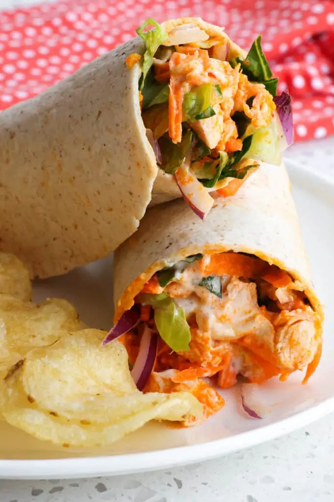 Make these quick and easy Buffalo Chicken Wraps bursting with spicy flavor and crunch. 