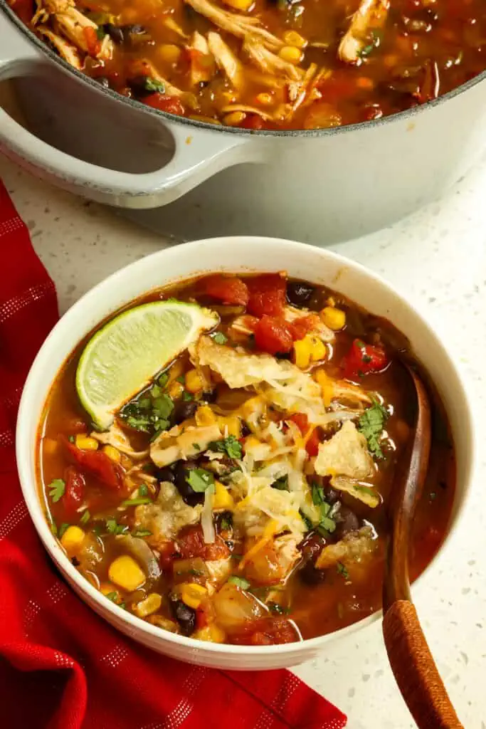 Chicken Taco Soup is bursting with fresh flavors from corn, black beans, fire-roasted diced tomatoes, green chiles, and a perfect spice blend.  