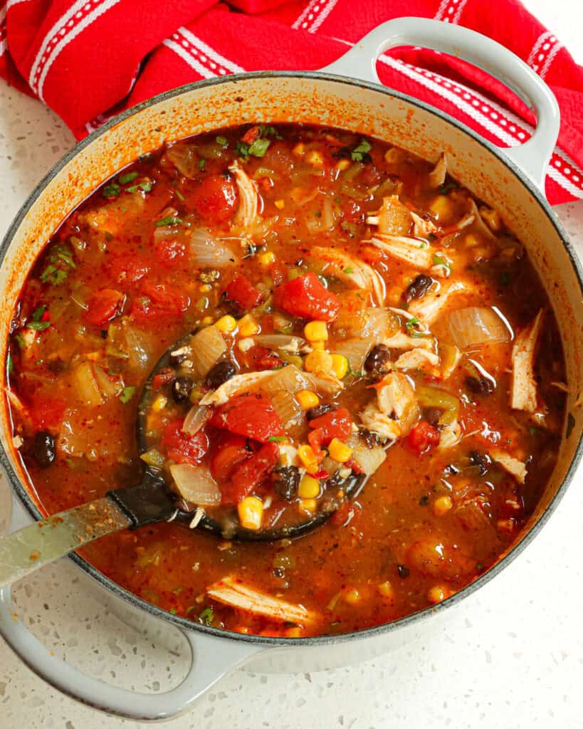 This delectable quick and easy Chicken Taco Soup is bursting with flavors from tender chicken corn, black beans, fire-roasted tomatoes, and green chiles.