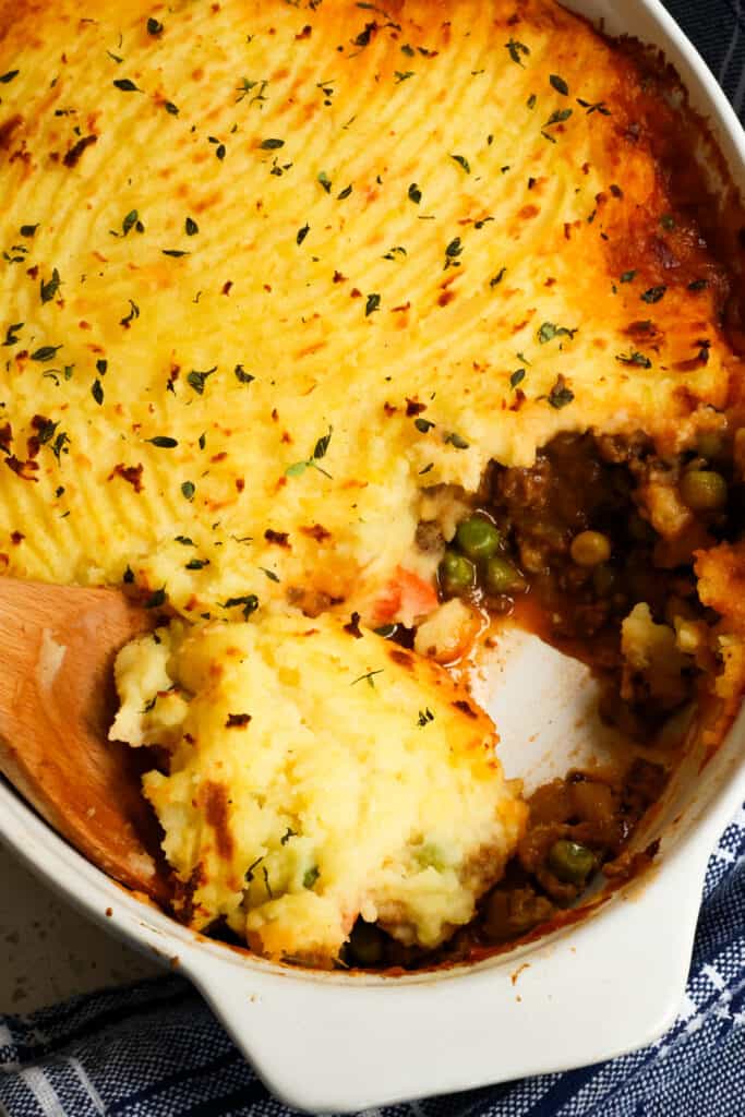 You are going to love this Cottage Pie with browned ground beef and cooked veggies in a rich gravy topped with smooth and creamy cheddar mashed potatoes.