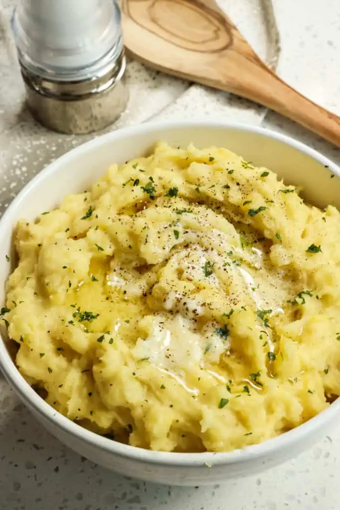 Garlic Mashed Potatoes is a heavenly combination of mashed Yukon potatoes with roasted garlic, butter, and cream.