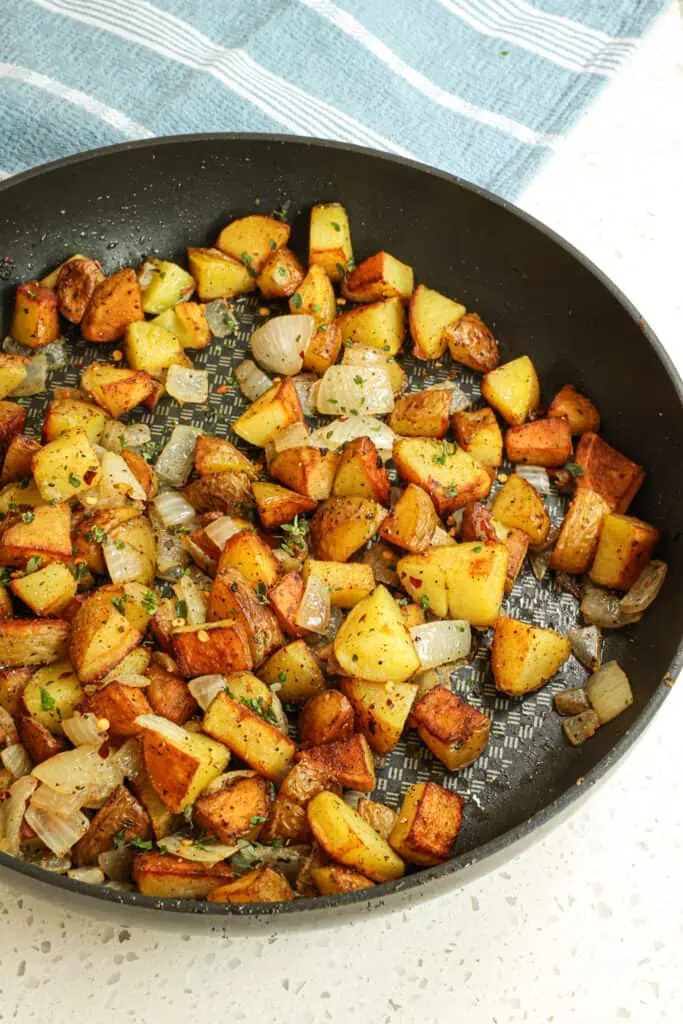 Cook the potatoes until browned or for about 4-5 minutes, then flip and brown the other side. Add the onions back to the skillet and stir to combine. 
