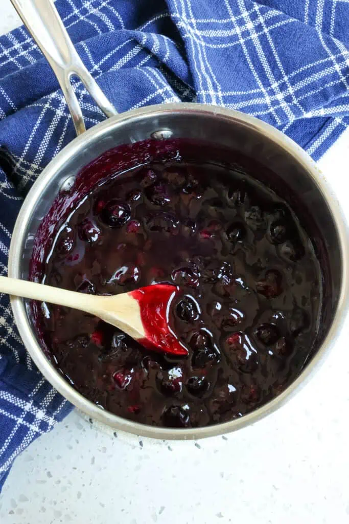 In a saucepan over medium heat, combine blueberries, water, sugar, and lemon juice.  Bring to a simmer, then reduce to a simmer and simmer for just a few minutes or until the blueberries begin to soften. 