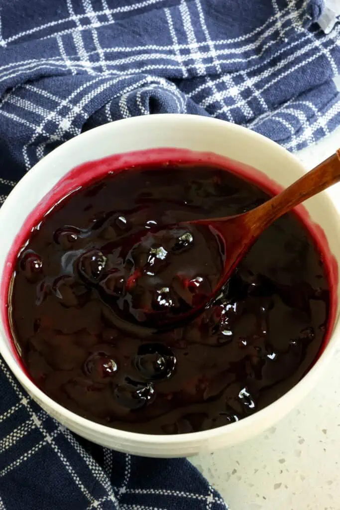 A delicious and easy Homemade Blueberry Sauce made with simple and common ingredients is delicious over cheesecake, ice cream, waffles, pancakes, oatmeal, or yogurt.