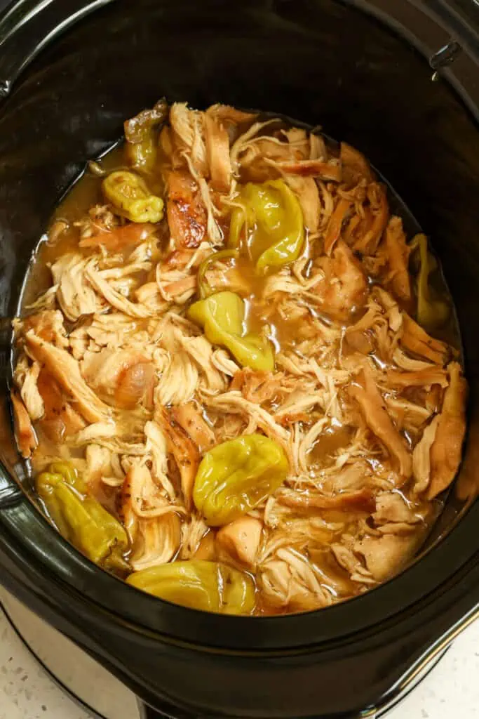 Cover and cook on low for 6-8 hours or on high for 4-5 hours or until it shreds very easily. Using two forks, shred the chicken right in the crock pot.