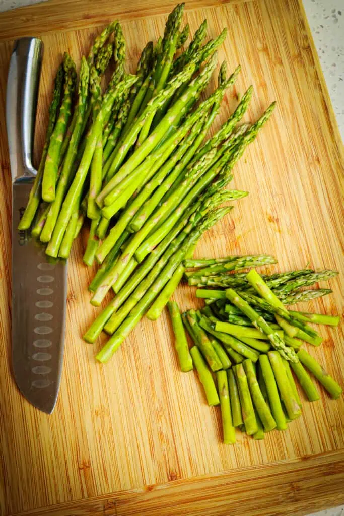 First, trim and cut the asparagus into 1-2 inch segments.
