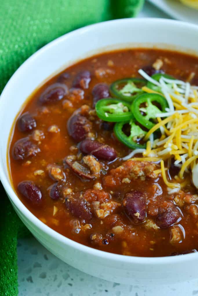 Start fall off right with a healthy turkey chili recipe.  This chili is perfectly seasoned and slow simmered for a thick robust finish. Make a big hot pot today and get ready to hear the accolades.