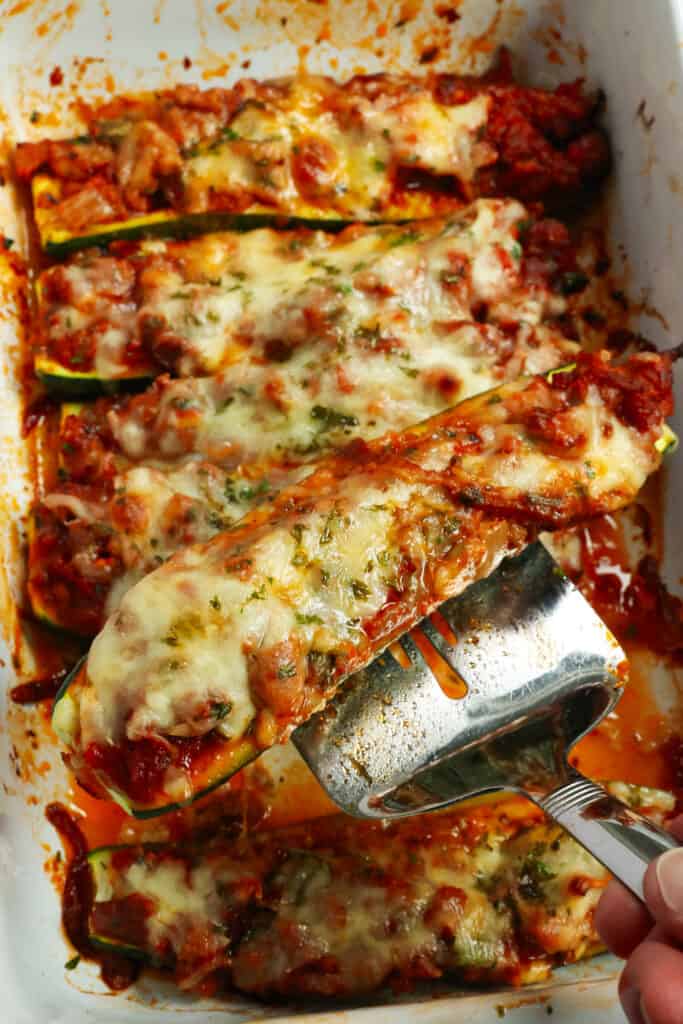 Bake for about 25 minutes or until the zucchini is tender and the cheese is melted and lightly browned. Top with the remaining chopped fresh parsley, and for best results, serve promptly. 