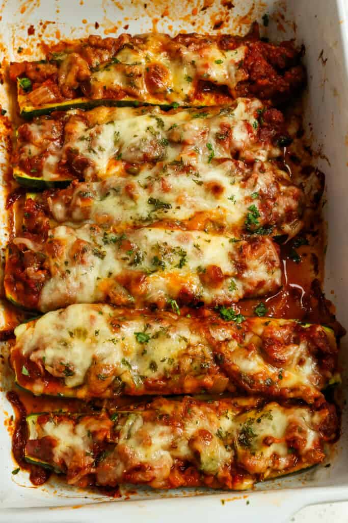 Delicious Zucchini Boats are quick and easy to make with Italian sausage, marinara, and Mozzarella cheese. They are low cab, keto-friendly, and perfect for using up all that summer garden zucchini.