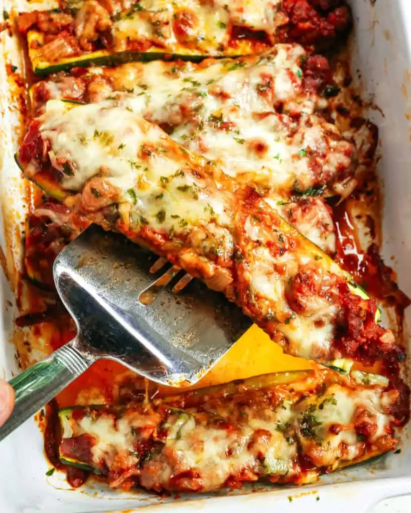 Bake for about 25 minutes or until the zucchini is tender and the cheese is melted and lightly browned. Top with the remaining chopped fresh parsley, and for best results, serve promptly. 