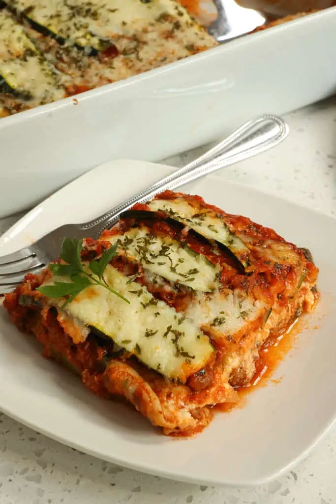 Zucchini Lasagna is a delicious, low-carbohydrate, keto-friendly, gluten-free casserole that replaces lasagna noodles with zucchini slices.