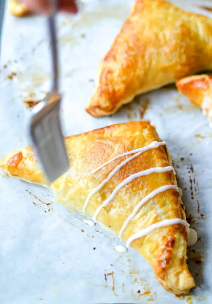 Whisk milk and powdered sugar together. Drizzle over cooled turnovers.
