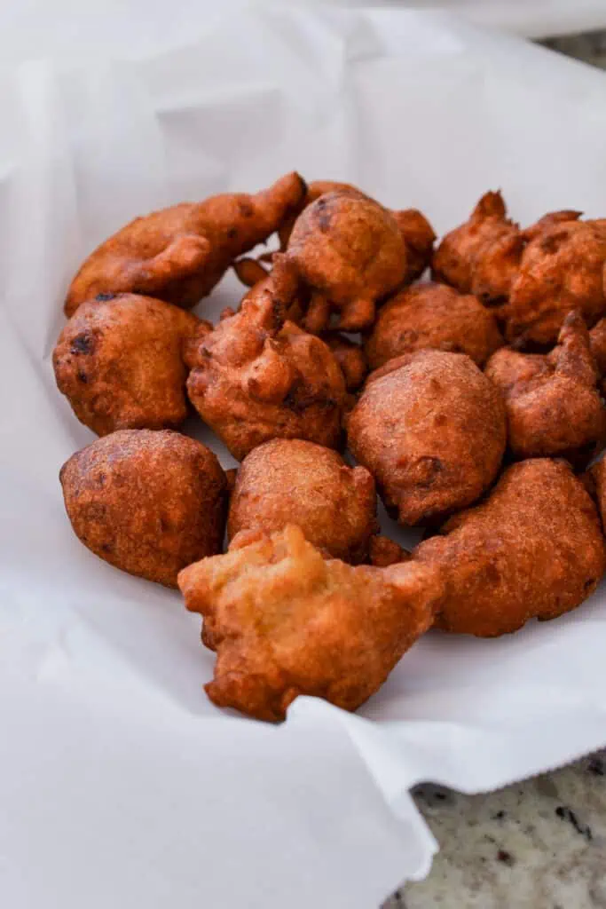 Dusted with powdered sugar, these crispy fried banana fritters are best served with some warm maple syrup