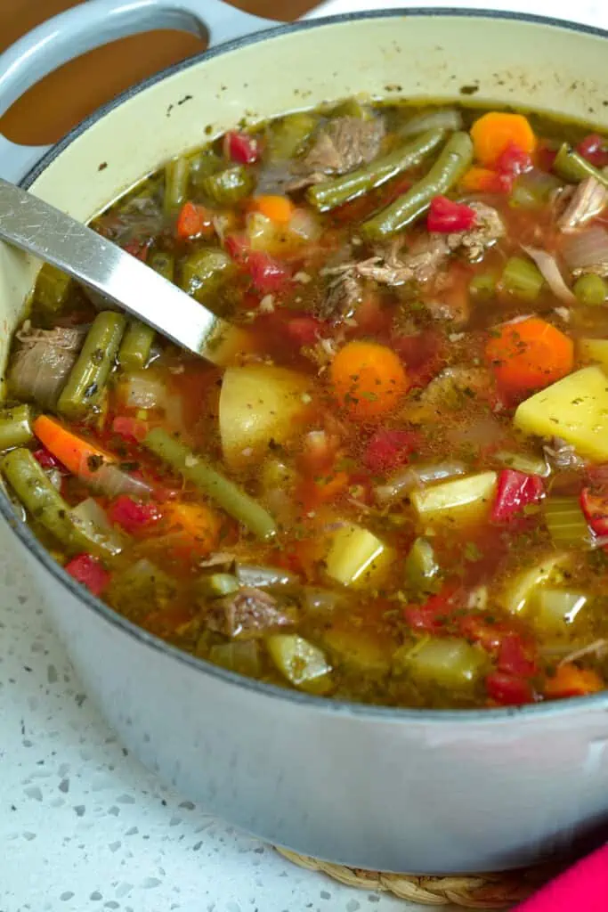 Beef Vegetable Soup is made with tender slow simmered chuck roast with celery, carrots, potatoes, tomatoes and green beans. 