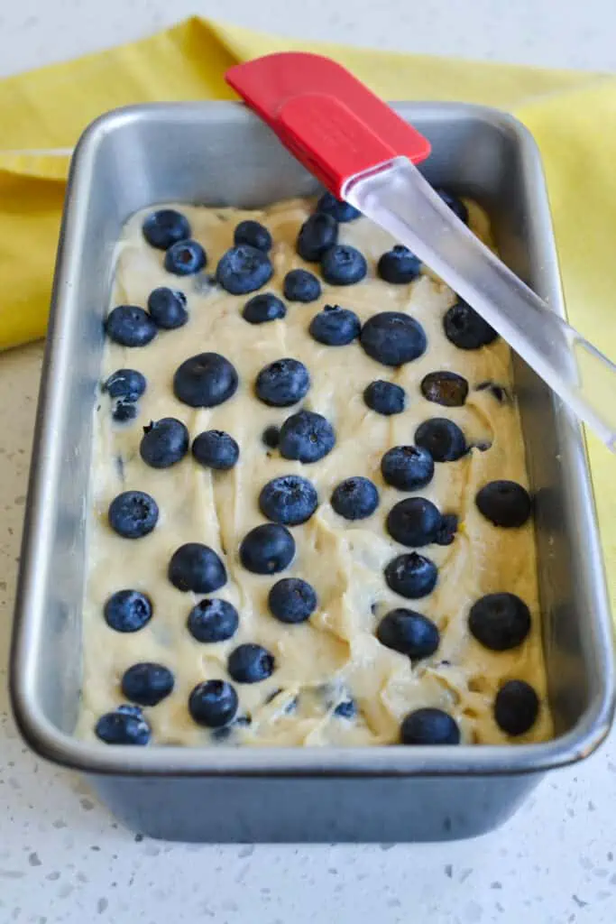 I like to use 2 cups of fresh blueberries, reserving at least 1/3 cup of fresh blueberries to push into the top of the loaf before baking. 