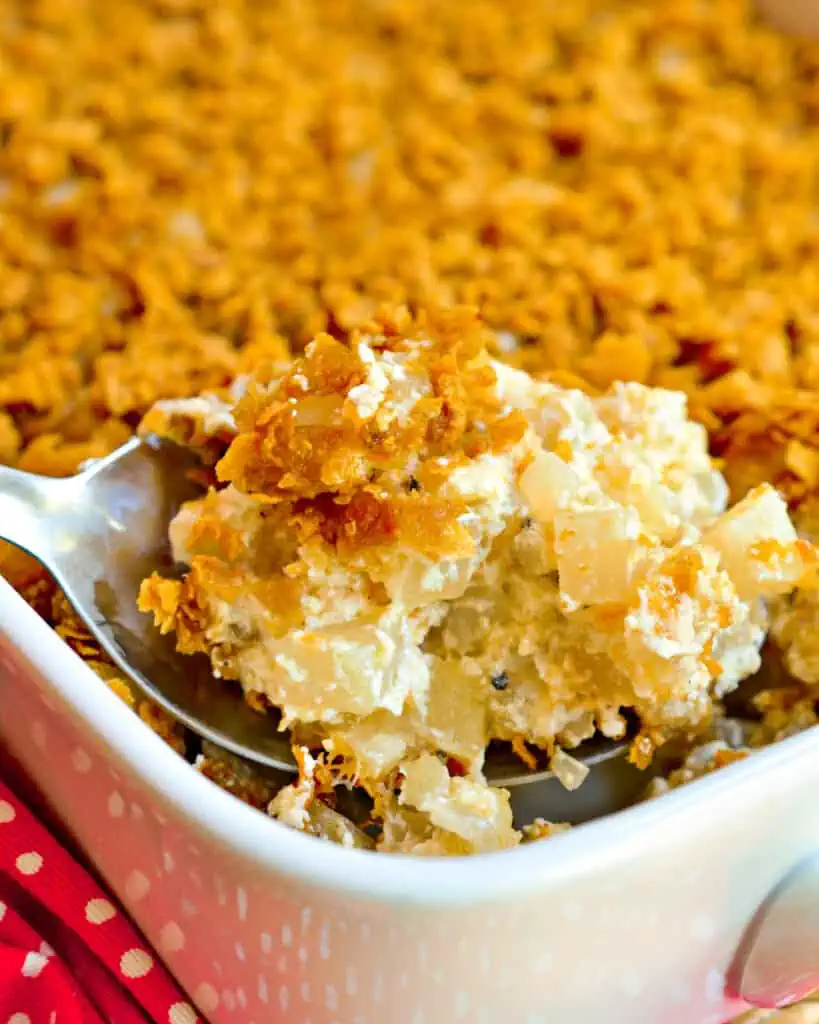 These Funeral Potatoes are frozen hash brown potatoes combined with sour cream, cream of chicken soup and oddles of cheese. 