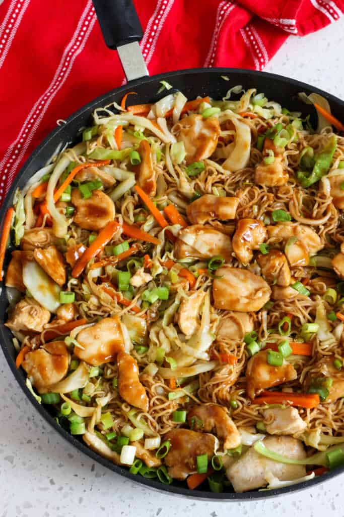 Finally, turn the heat up to medium, adding the chicken and noodles back to the pan to warm.  Add the sauce and stir to combine, cooking for 2 minutes or until the sauce is thickened and everything is coated with sauce.