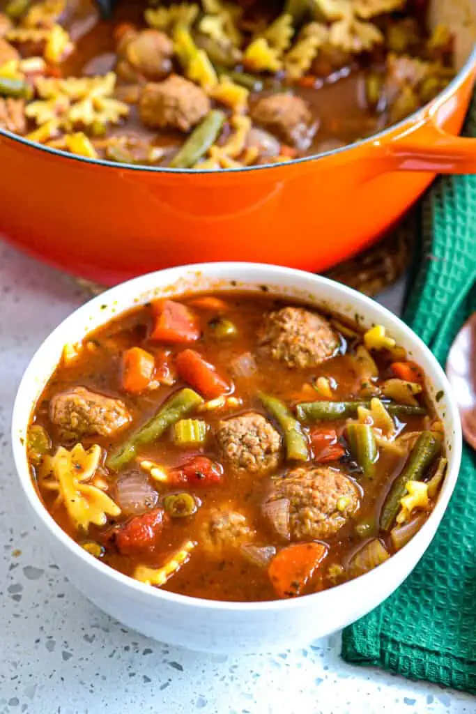  This delectable tender meatball soup combines onions, carrots, celery, and green beans with Italian seasonings in a rich tomato beef broth with Italian meatballs and mini Farfalle Pasta.