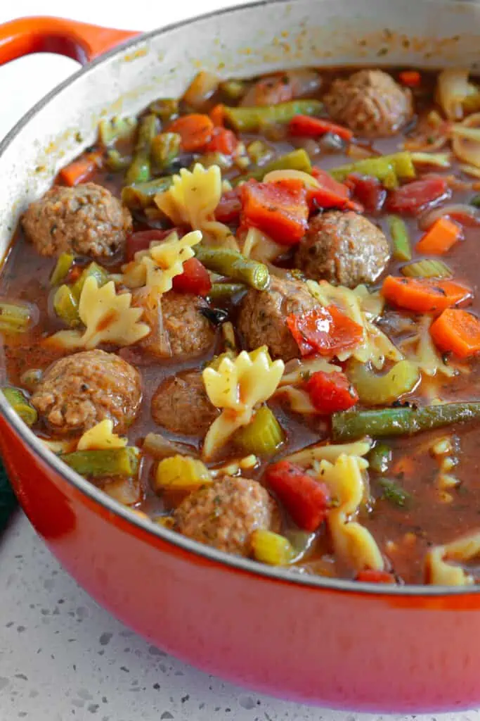 Meatball Soup made easily with meatballs, carrots, celery, tomato and green beans. 