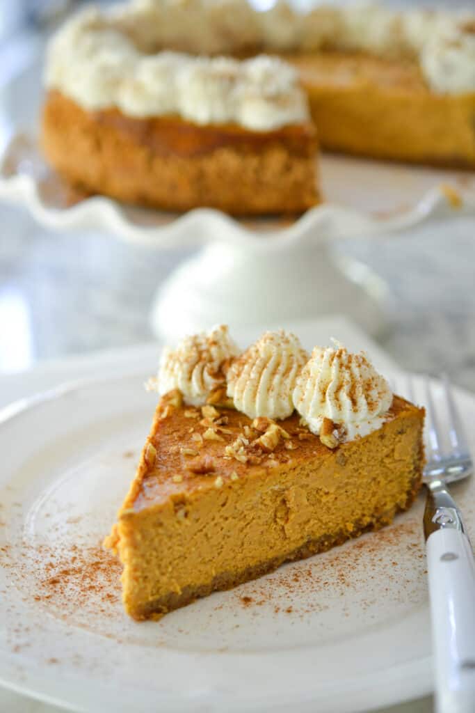 This delectable pumpkin cheesecake is a cream cheese based delight blended with festive fall pumpkin spice and baked in an easy-to-make graham cracker crust. 