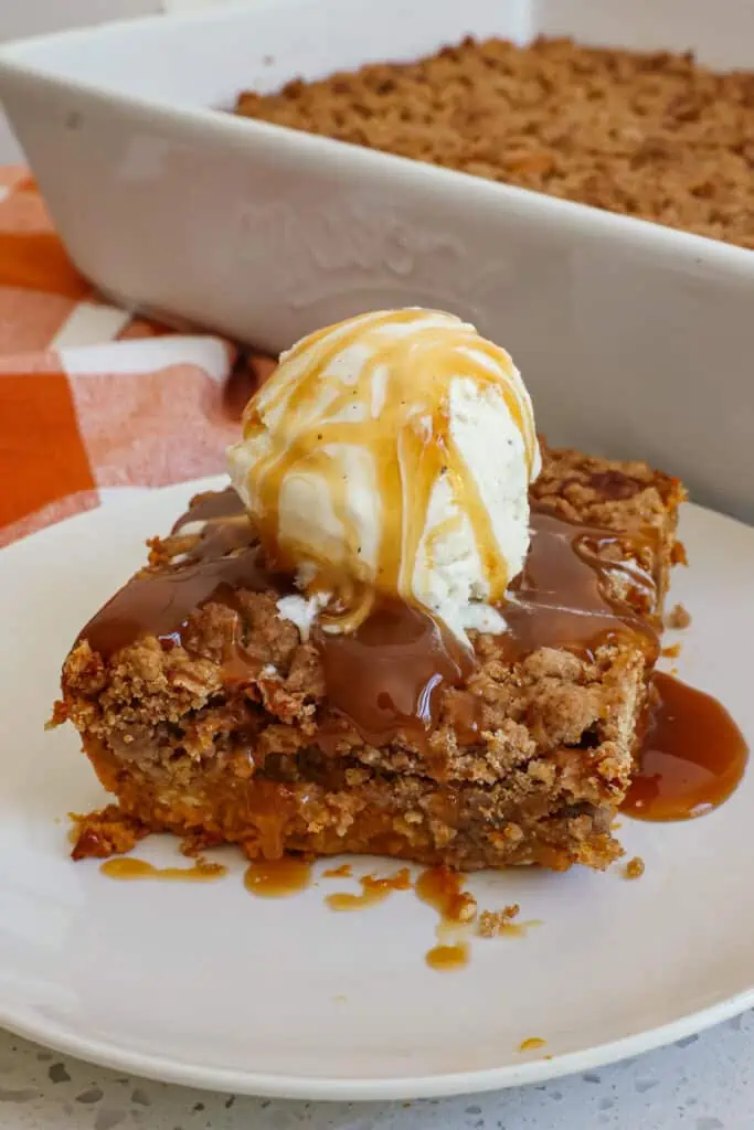 This Pumpkin Dump Cake is like eating the best part of the pumpkin pie topped with a crunchy cinnamon pecan topping.