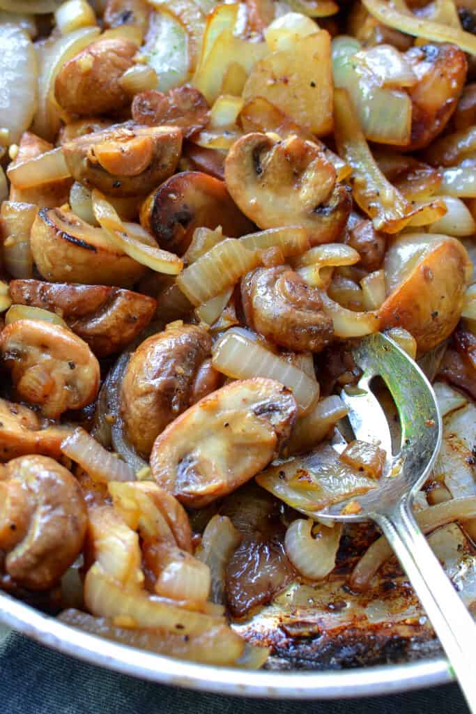 These easy Sauteed Mushrooms are an elegant but easy side.  Serve over grilled steak, alongside beef tenderloin or grilled chicken, or eat by itself as a light dinner.