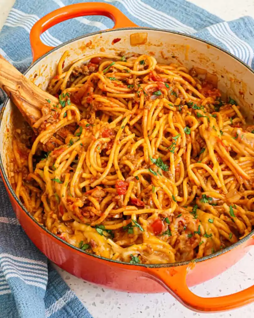 An over head view of taco spaghetti garnished with chopped cilantro. 