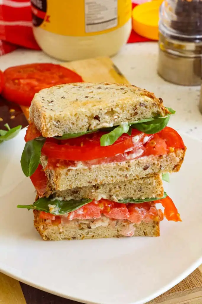 This tomato sandwich  is by far one of my favorite summer sandwiches and one that I put on repeat over the summer and early fall months. 