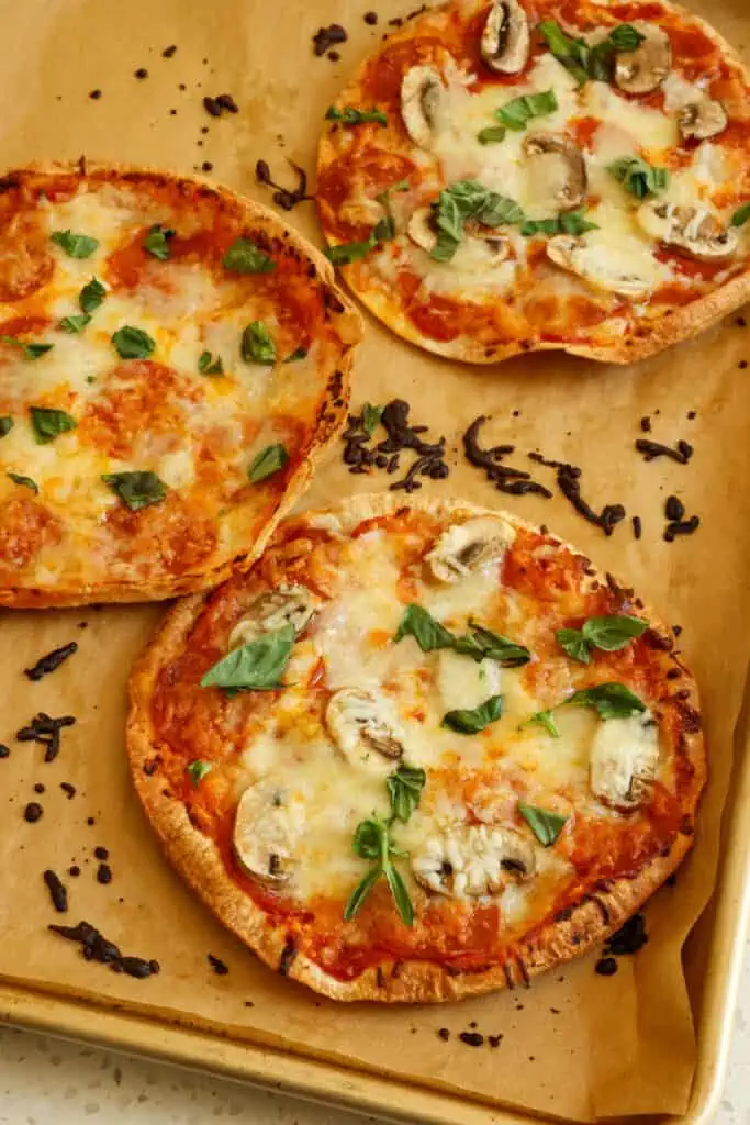 These crisp and easy flour Tortilla Pizzas take less than 15 minutes, and they are always a huge hit. 