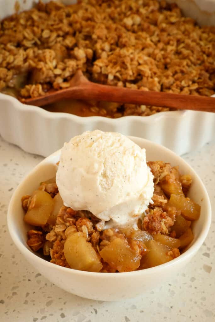 This Homemade Apple Crisp Recipe is a simple dessert made with crips tart apples mixed with sugar and cinnamon and sprinkled with a crunchy sweet oatmeal crumb topping.  