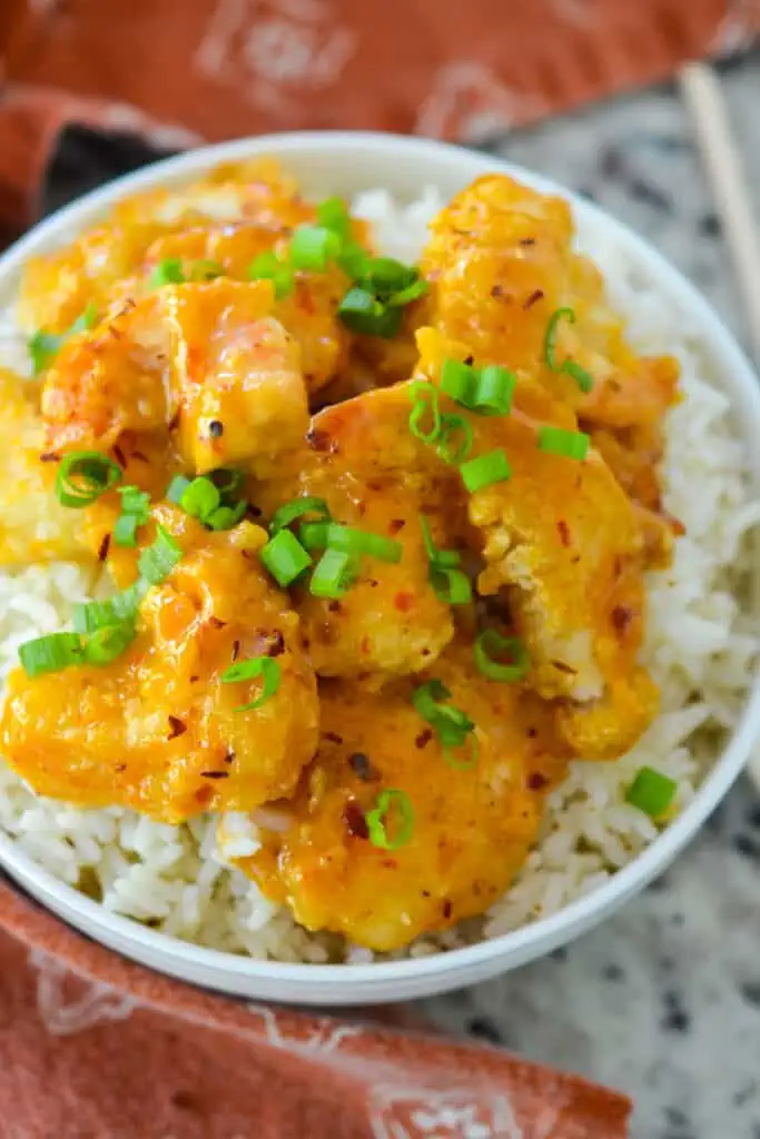 Delicious crispy, crunchy fried shrimp smothered in a creamy sweet and spicy chili sauce. In this recipe, we make our own chili sauce, giving this bang bang shrimp recipe an extra kick of homemade goodness.