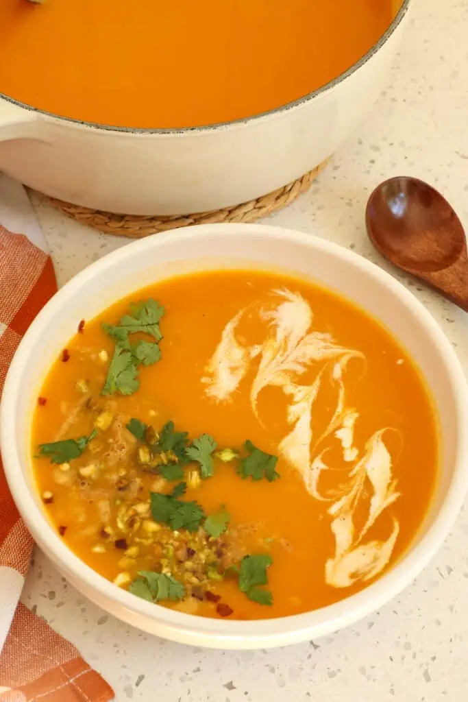 Easy Ginger Carrot Soup seasoned with garlic and cumin is a tasty change from the usual fare. Cook a pot up today and enjoy the harvest.